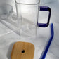 Glass tumbler with bamboo lid, glass straw and handle